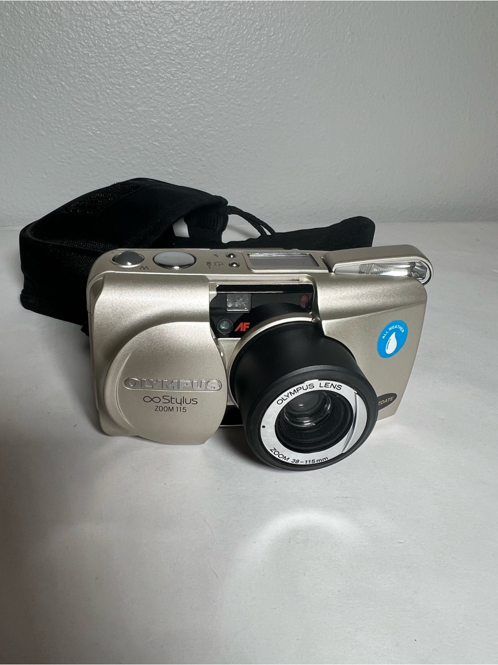 Olympus Stylus Zoom 115 Silver Point-and-Shoot Film Camera and case